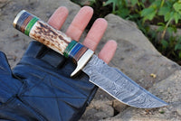 7.5-inch luxury hunting knife with Damascus steel blade and antler horn handle.
