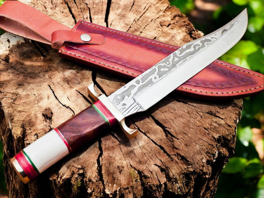 Full view of hand forged Bowie knife with leather sheath
