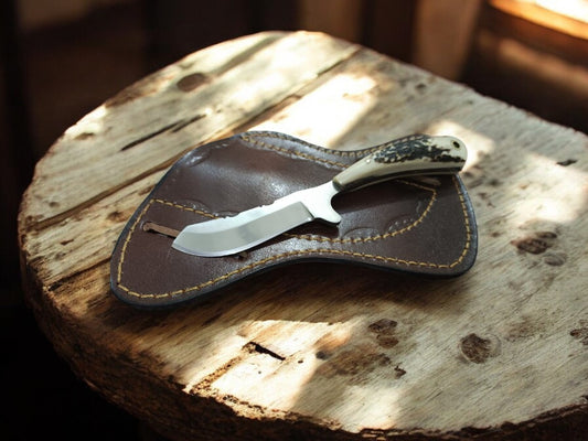 Handcrafted cowboy cross draw knife with D2 steel blade and antler handle.
