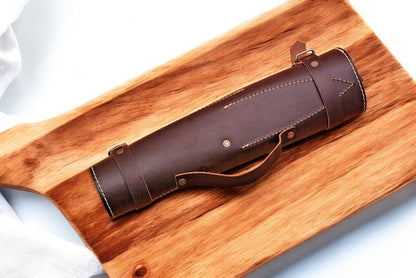 Leather roll opened to showcase the full knife set.
