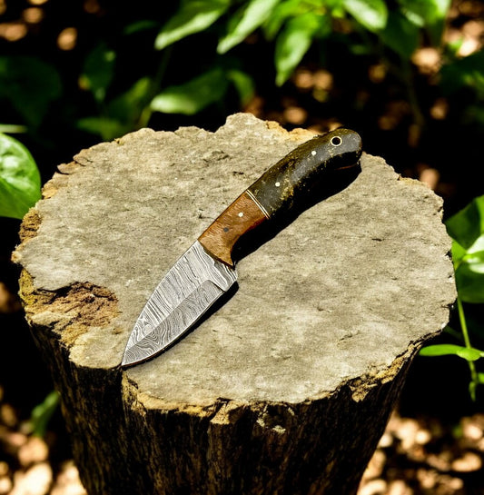 "Custom skinning knife with Damascus steel blade and exotic wood handle"
