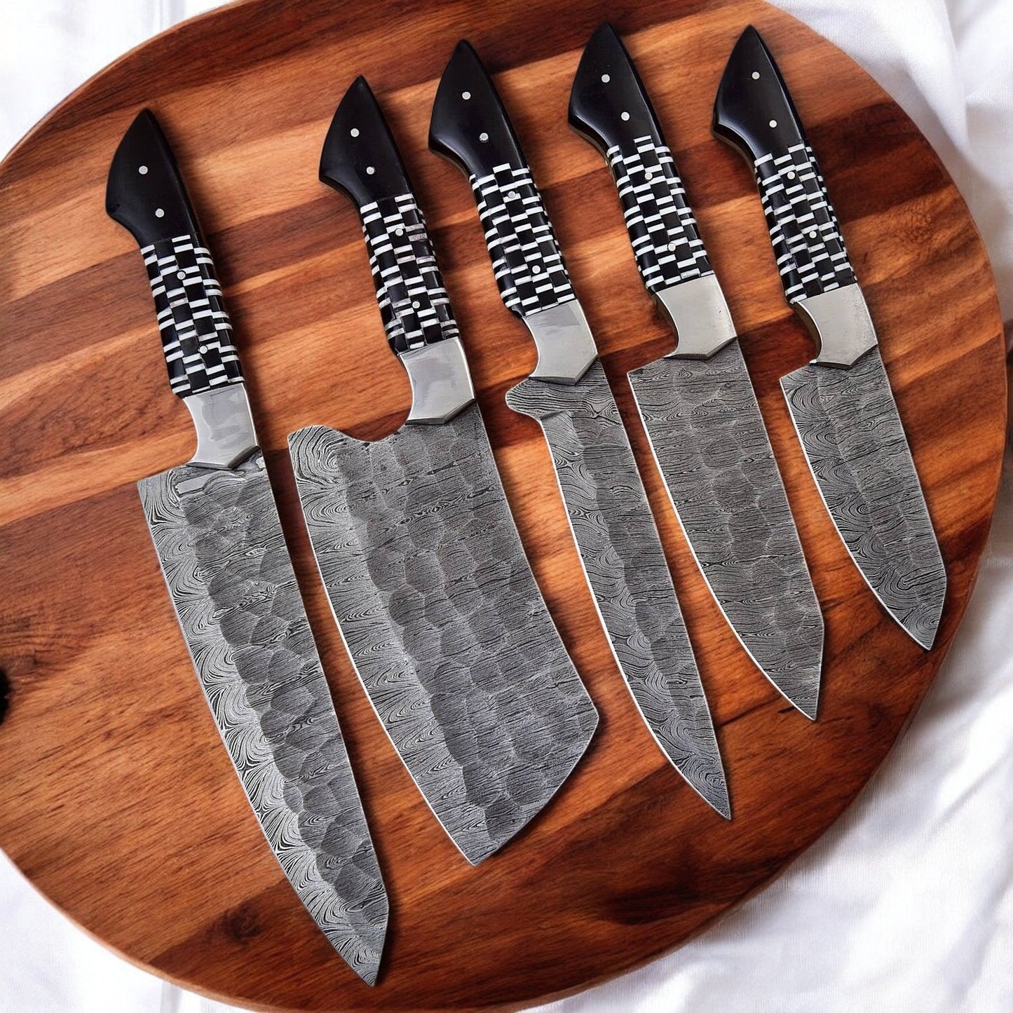 Handmade custom kitchen knife set with Damascus steel blades.
