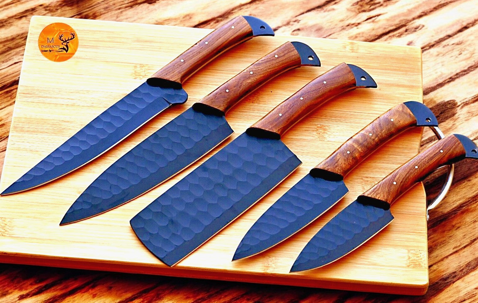 Handcrafted Damascus steel knife set with burl wood handles.
