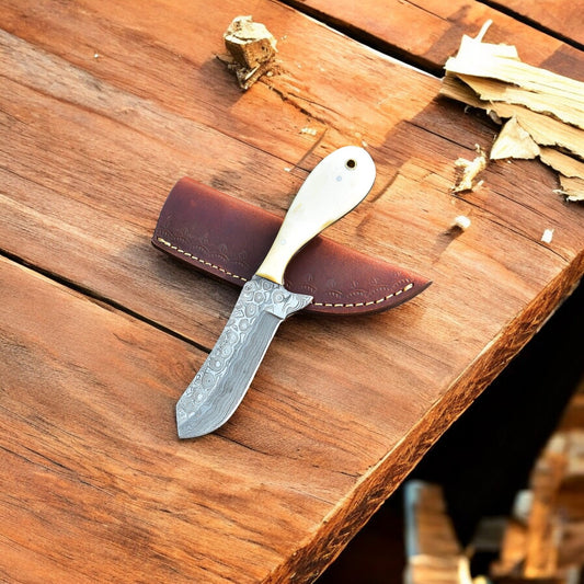 Close-up of the Damascus steel blade on the Cowboy Belt Knife.
