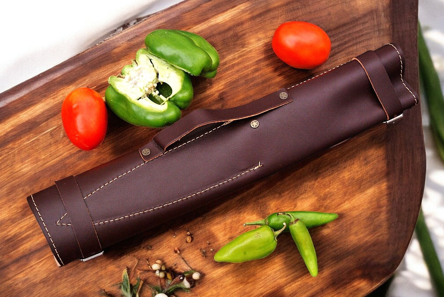 Leather roll with custom handmade chef knife set.
