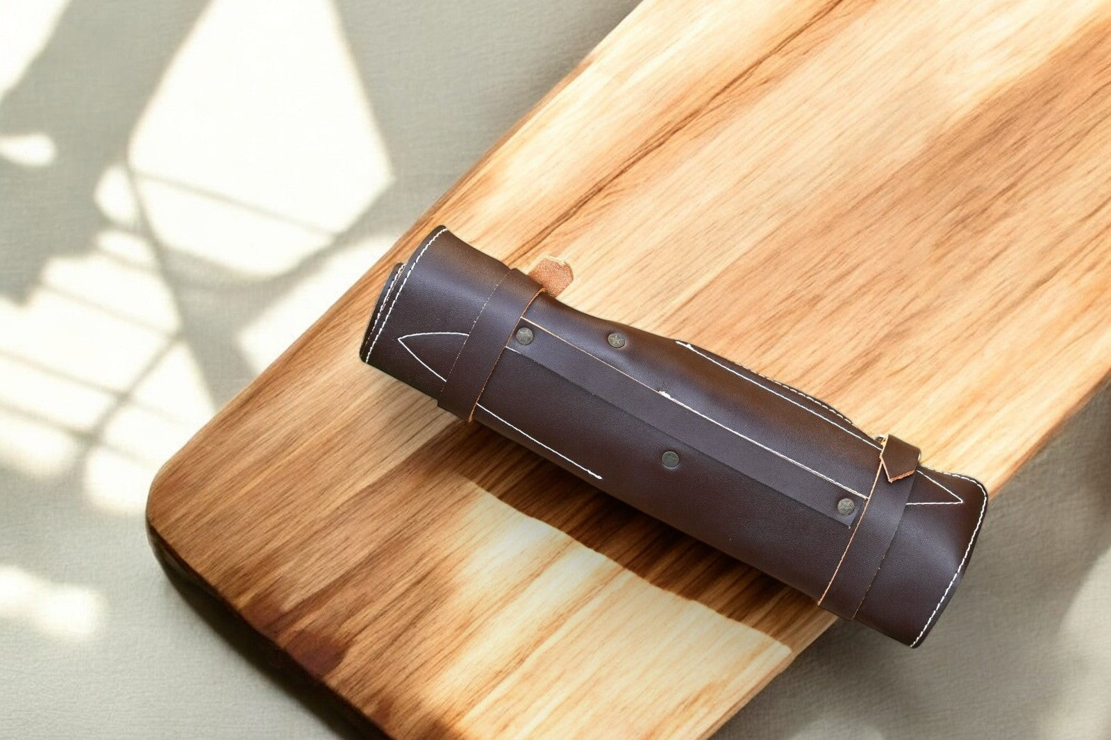 "Leather roll for professional kitchen knife set storage"
