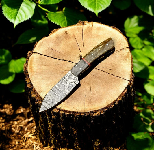 "Handmade Damascus hunting knife with exotic wood handle."
