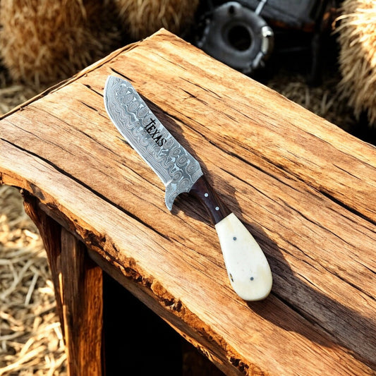 Close-up of Bone and Rosewood Handle on Damascus Steel Cowboy Knife
