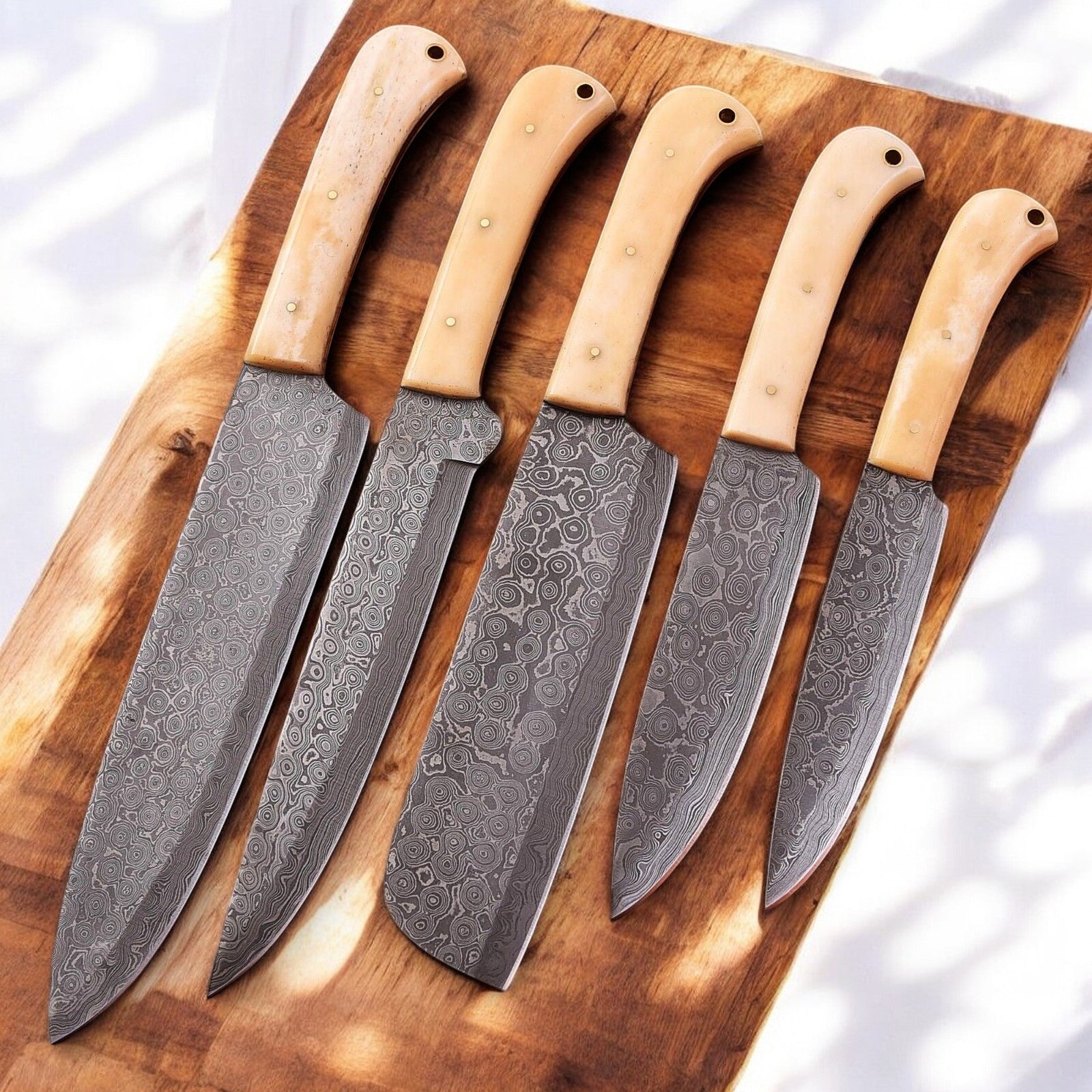 Close-up of a Damascus steel blade showcasing intricate patterns.
