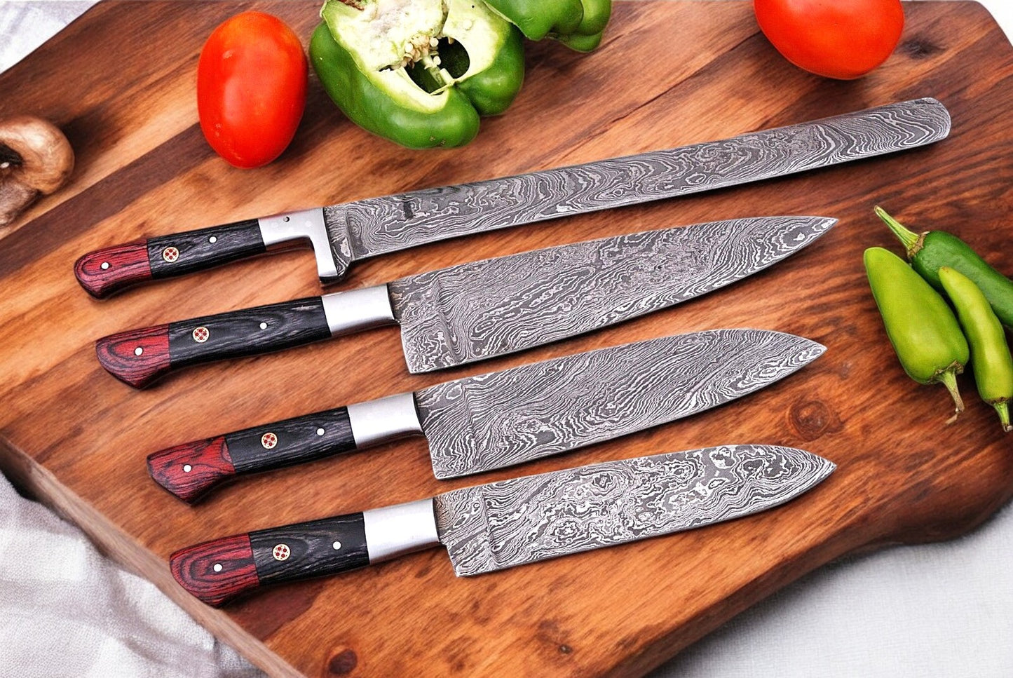 Handmade chef knife set with Damascus steel blades.
