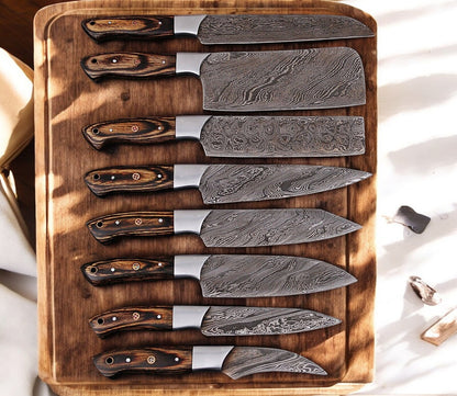 Custom kitchen knife set with Damascus steel blades and exotic wood handles.
