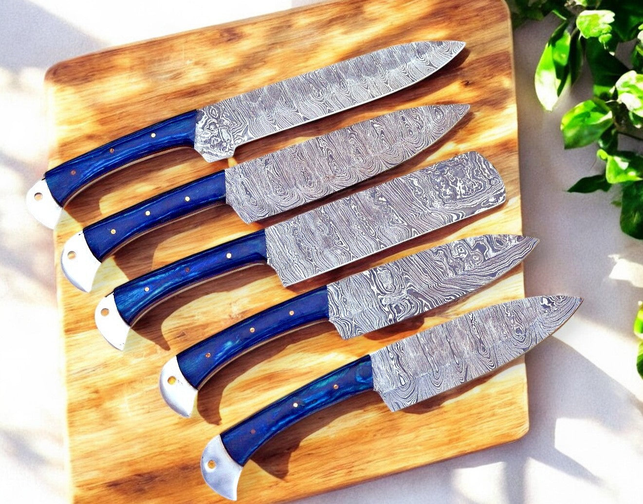 Close-up of Damascus steel blades showcasing intricate patterns.
