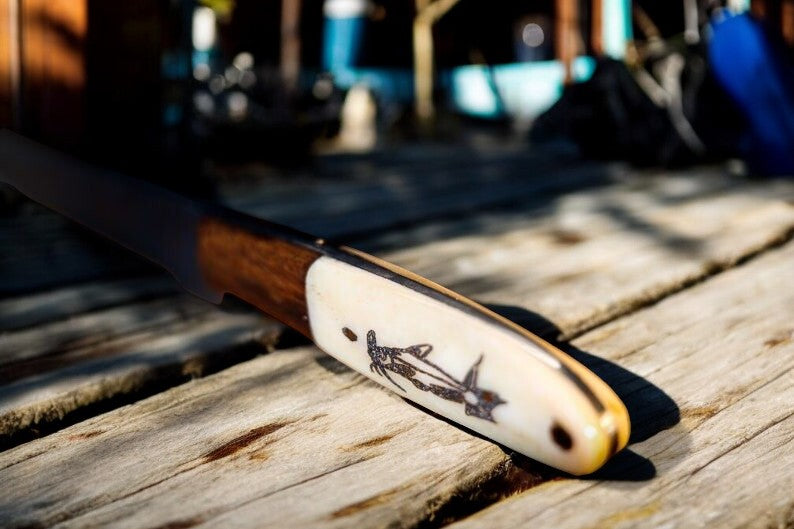 Close-up of Damascus Blade on Fillet Knife with Engraved Handle
