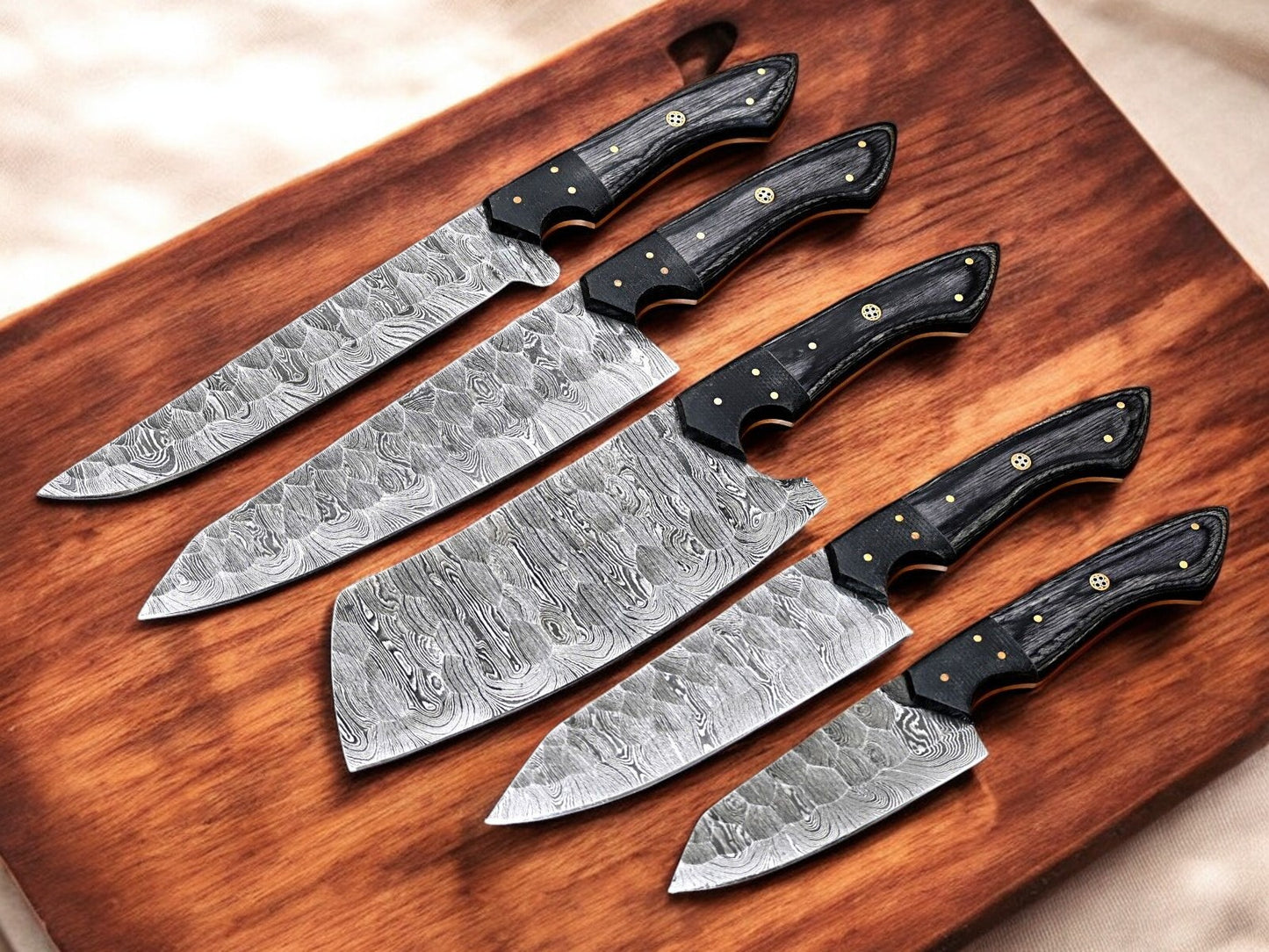 Handmade chef knife with Damascus steel blade and exotic wood handle.
