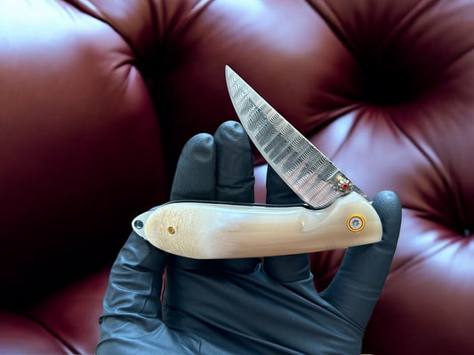 "Bone handle of the every day carry knife, designed for comfort."
