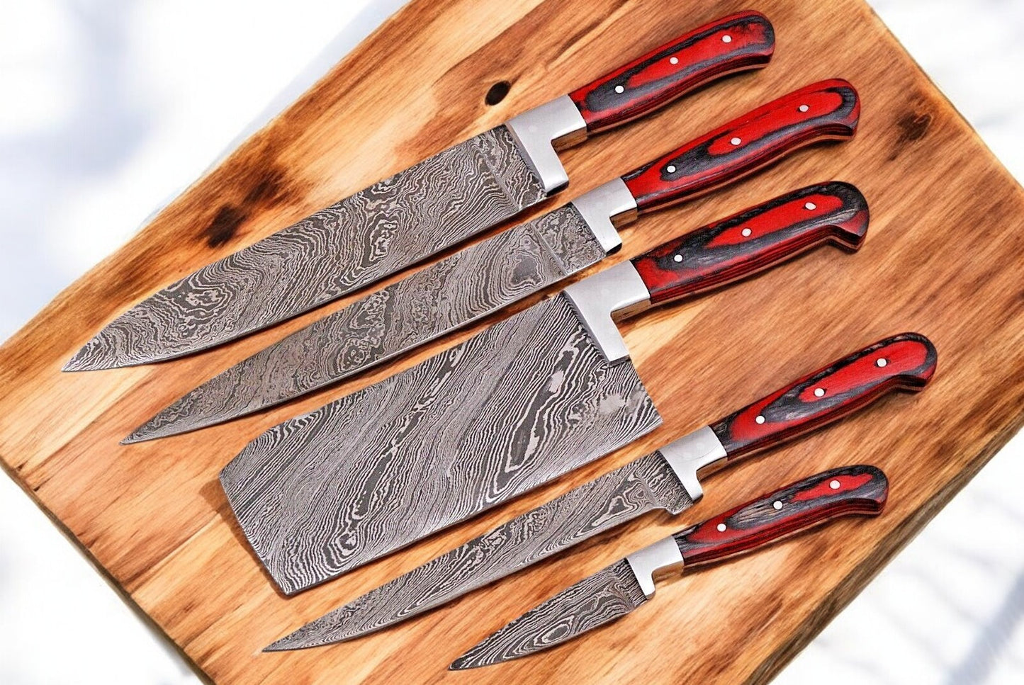 Handmade Damascus steel chef knife with an exotic wood handle.
